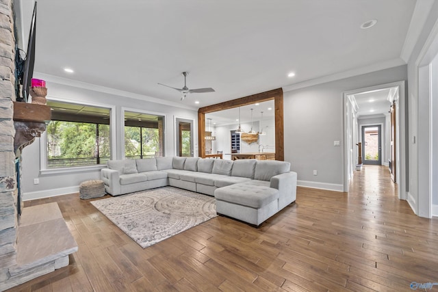 14 Blue Meadow Way, Gurley, AL 35748 - living room with a ceiling fan, a stone fireplace, hardwood / wood-style flooring, recessed lighting, and baseboards