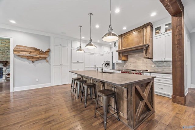 14 Blue Meadow Way, Gurley, AL 35748 - kitchen featuring a sink, baseboards, recessed lighting, decorative backsplash, and an island with sink