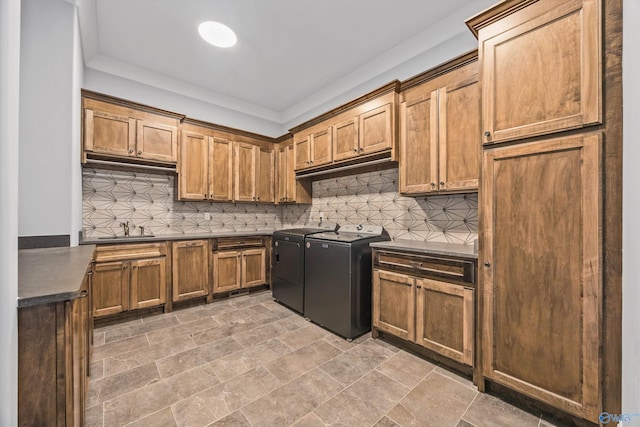 14 Blue Meadow Way, Gurley, AL 35748 - kitchen with washer and clothes dryer, dark countertops, a sink, and backsplash