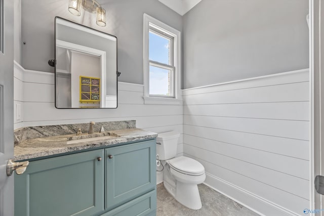 14 Blue Meadow Way, Gurley, AL 35748 - bathroom featuring wainscoting, vanity, toilet, wood walls, and tile patterned flooring