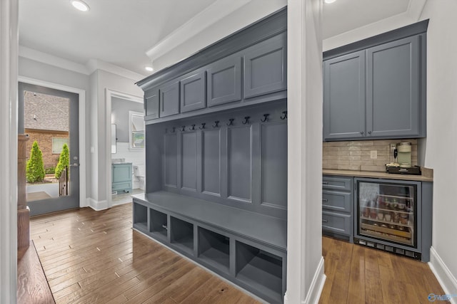 14 Blue Meadow Way, Gurley, AL 35748 - mudroom with beverage cooler, a dry bar, dark wood-type flooring, ornamental molding, and recessed lighting