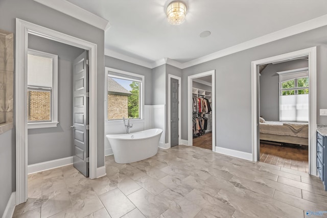 14 Blue Meadow Way, Gurley, AL 35748 - ensuite bathroom with a freestanding bath, a spacious closet, healthy amount of natural light, baseboards, and crown molding
