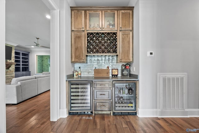 14 Blue Meadow Way, Gurley, AL 35748 - indoor bar featuring beverage cooler, dark wood-style floors, ceiling fan, tasteful backsplash, and ornamental molding