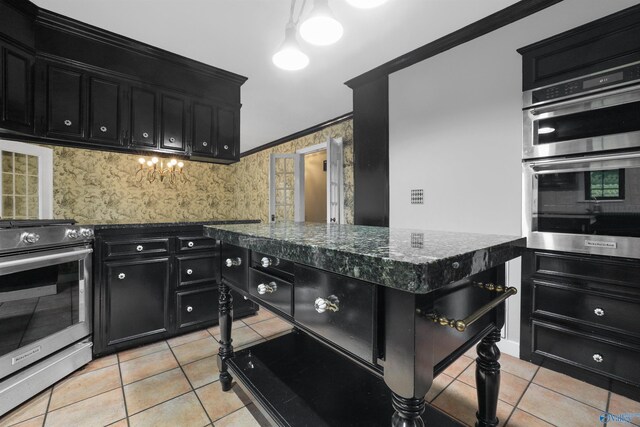 kitchen featuring light tile patterned floors, stainless steel appliances, decorative backsplash, and crown molding