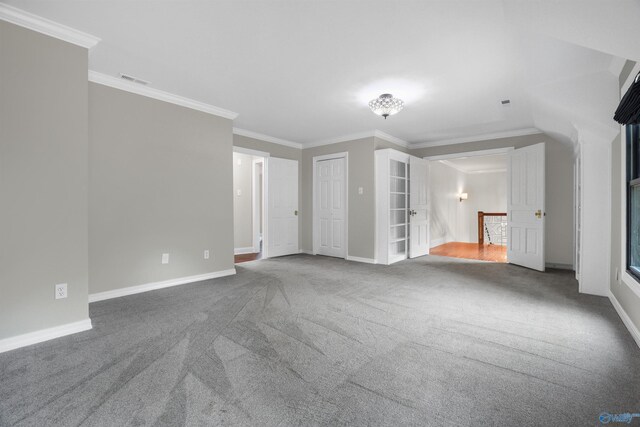 interior space featuring carpet and crown molding