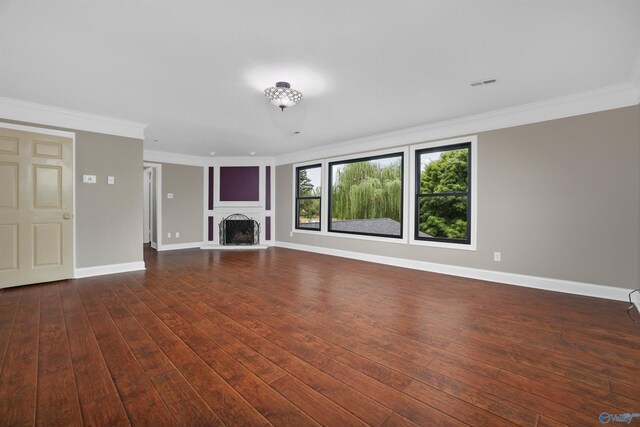 unfurnished living room with dark hardwood / wood-style floors and ornamental molding