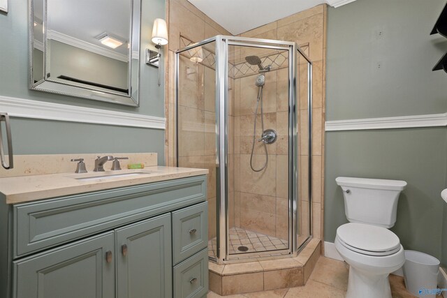 bathroom featuring an enclosed shower, tile patterned flooring, toilet, and vanity