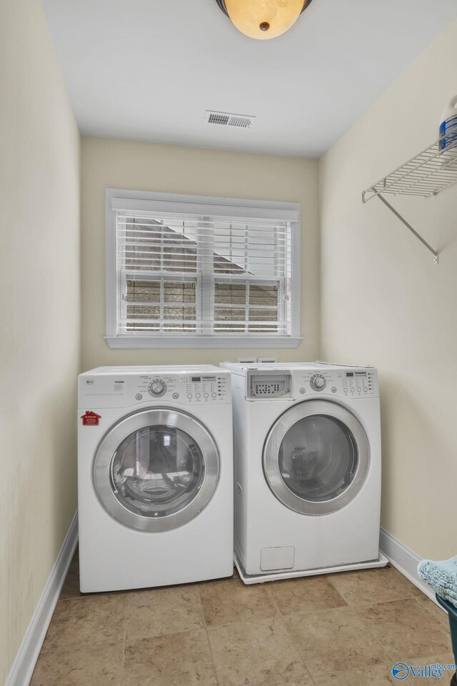 washroom with washer and clothes dryer