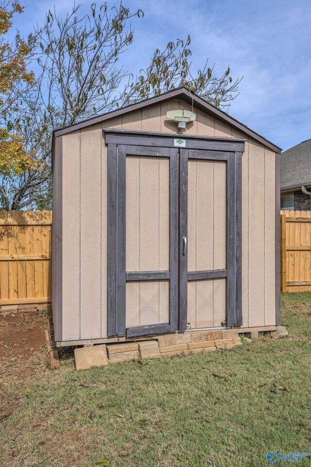 view of outdoor structure with a lawn