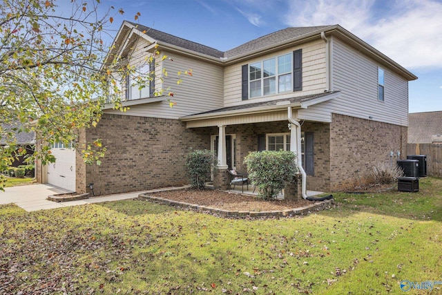 view of front of home with a garage, cooling unit, a front lawn, and a porch