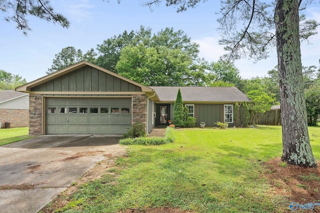 702 Royce Cir SE, Huntsville, AL 35803 - ranch-style house with a garage, driveway, stone siding, and board and batten siding
