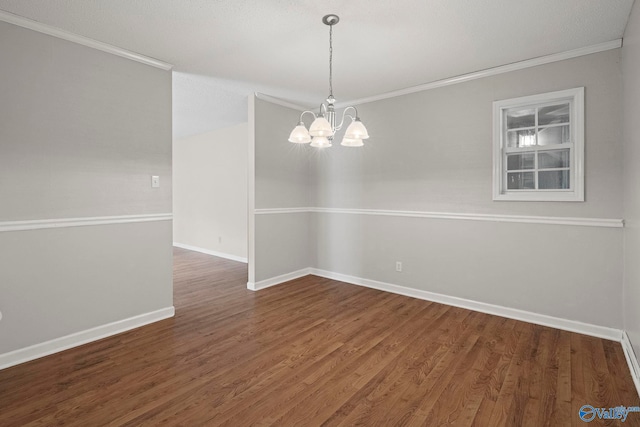 702 Royce Cir SE, Huntsville, AL 35803 - empty room with a chandelier, crown molding, and wood finished floors