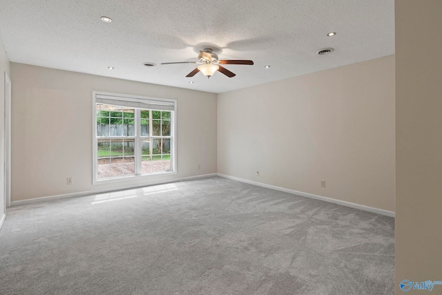 702 Royce Cir SE, Huntsville, AL 35803 - empty room with carpet floors, ceiling fan, a textured ceiling, and recessed lighting