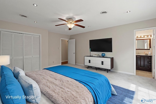 702 Royce Cir SE, Huntsville, AL 35803 - bedroom featuring light carpet, a closet, ensuite bathroom, ceiling fan, and recessed lighting