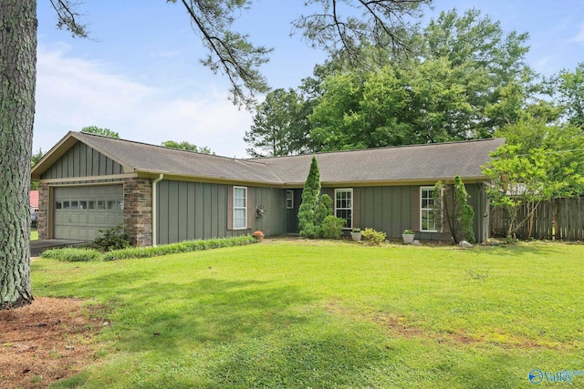 702 Royce Cir SE, Huntsville, AL 35803 - ranch-style house with board and batten siding, an attached garage, and a shingled roof