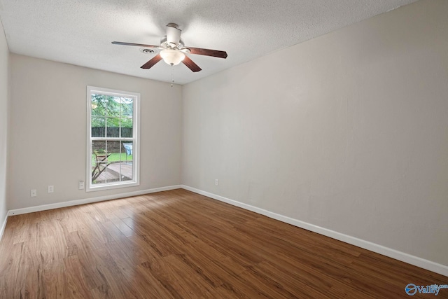 702 Royce Cir SE, Huntsville, AL 35803 - unfurnished room featuring wood finished floors, ceiling fan, and a textured ceiling