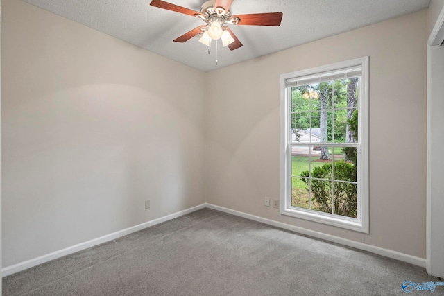 702 Royce Cir SE, Huntsville, AL 35803 - carpeted empty room featuring a ceiling fan and a textured ceiling