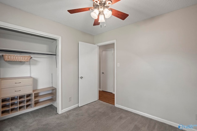 702 Royce Cir SE, Huntsville, AL 35803 - unfurnished bedroom featuring carpet flooring, a closet, and ceiling fan
