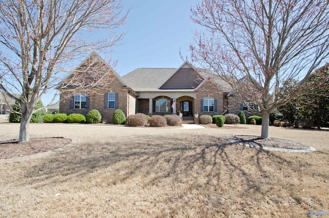 view of front of house with brick siding