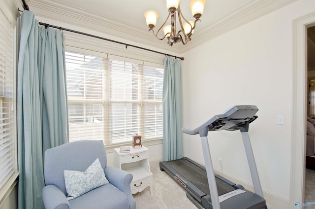 exercise room with crown molding, a notable chandelier, carpet flooring, and baseboards