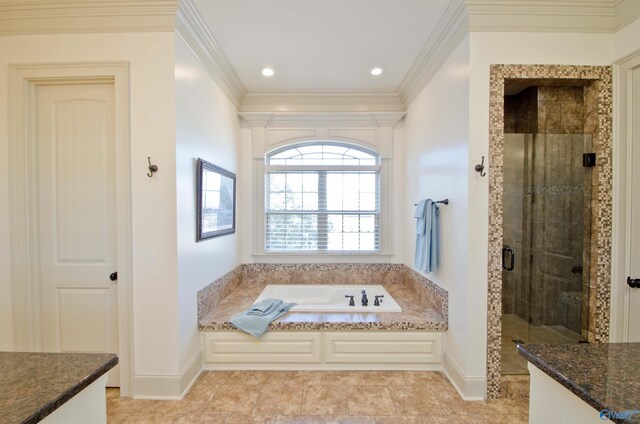 full bath featuring crown molding, a garden tub, baseboards, and a shower stall