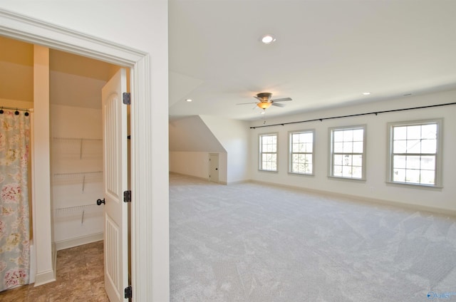 additional living space featuring ceiling fan, recessed lighting, light colored carpet, and baseboards