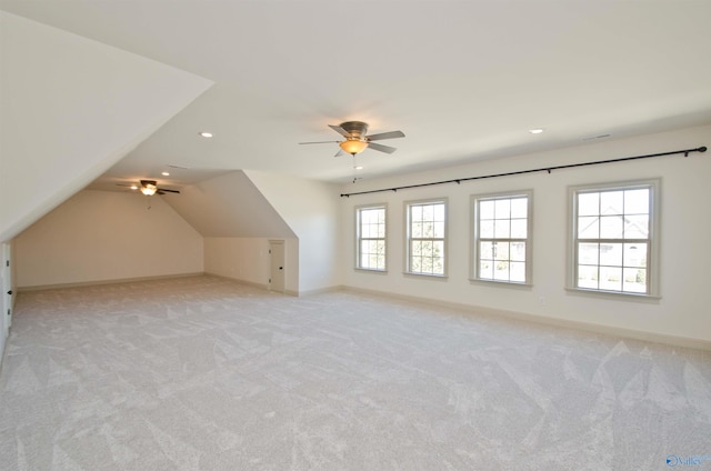 bonus room with light carpet, recessed lighting, lofted ceiling, and baseboards