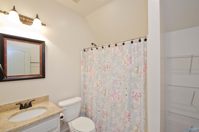 full bathroom with vanity, curtained shower, and toilet