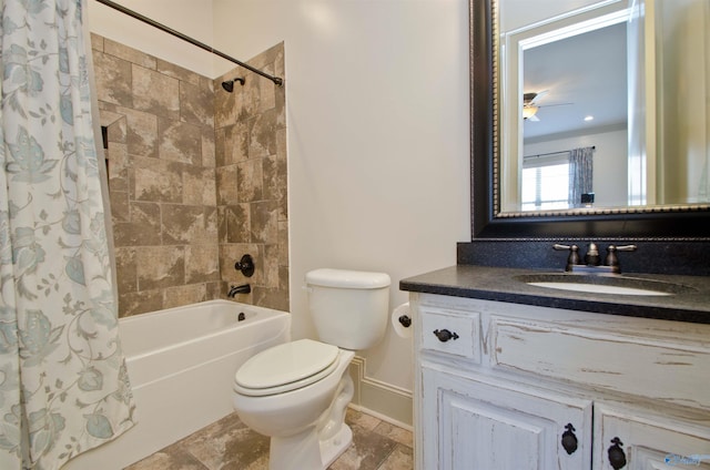 bathroom featuring vanity, toilet, shower / tub combo with curtain, and baseboards