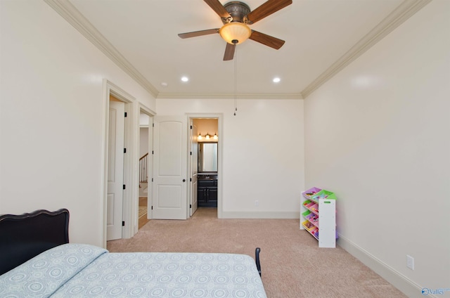 carpeted bedroom featuring recessed lighting, baseboards, ensuite bath, and crown molding