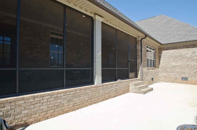 view of patio / terrace with a sunroom