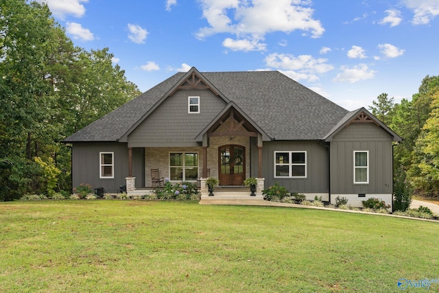 view of front facade with a porch and a front lawn