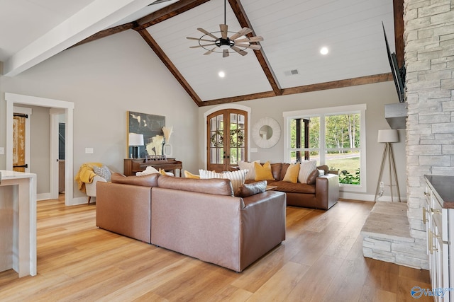 living room with beam ceiling, light hardwood / wood-style floors, high vaulted ceiling, and ceiling fan