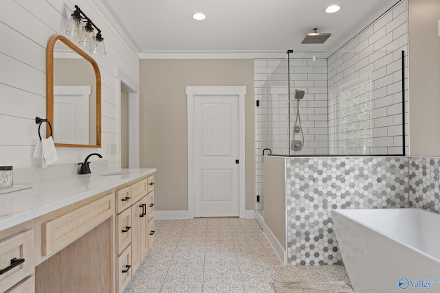 bathroom featuring plus walk in shower, vanity, tile patterned floors, and crown molding