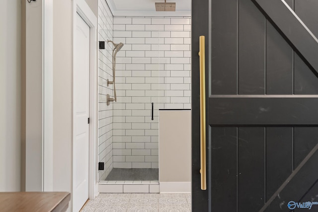 bathroom with tile patterned flooring and walk in shower