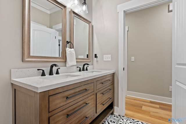 bathroom with vanity and hardwood / wood-style flooring