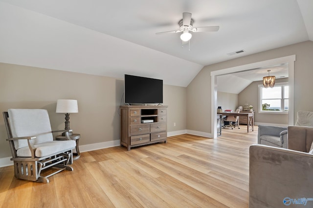 sitting room featuring ceiling fan, light wood-type flooring, and vaulted ceiling