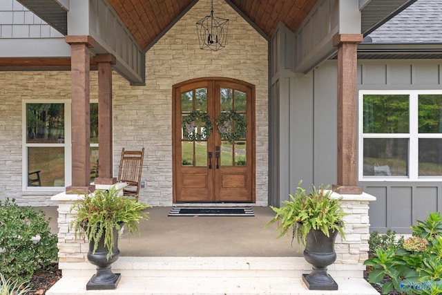 entrance to property featuring french doors and covered porch