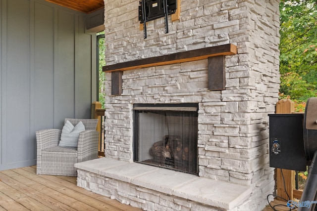 exterior details with an outdoor stone fireplace