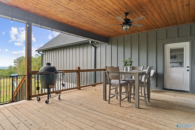 wooden deck featuring ceiling fan