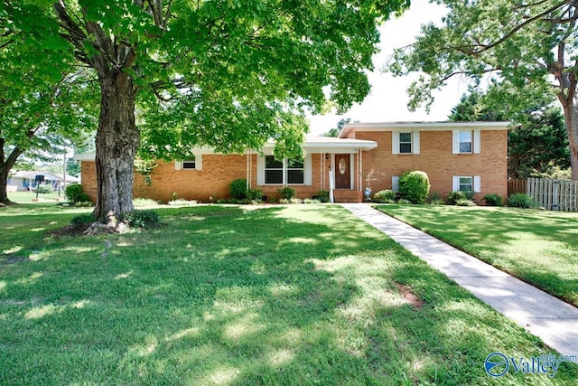 split level home featuring a front yard