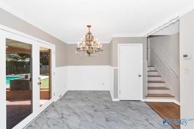 unfurnished dining area featuring ornamental molding and french doors