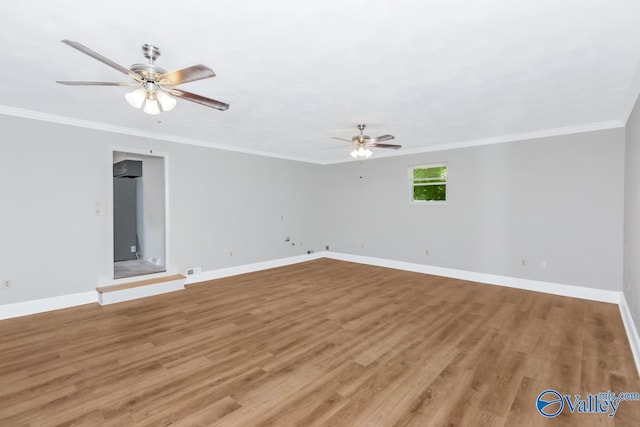 spare room featuring crown molding, ceiling fan, and light hardwood / wood-style flooring