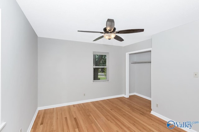 unfurnished bedroom with a closet, ceiling fan, and light wood-type flooring