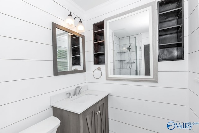 bathroom featuring crown molding, vanity, toilet, and a tile shower