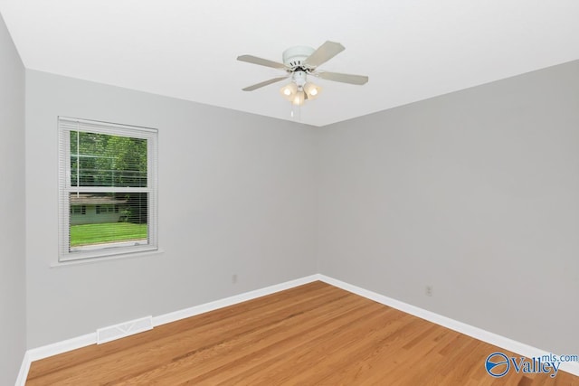 unfurnished room with hardwood / wood-style floors and ceiling fan