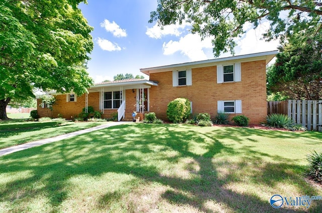 split level home with a front yard