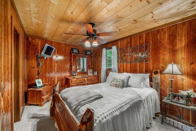 bedroom with wood walls, carpet flooring, wooden ceiling, and ceiling fan