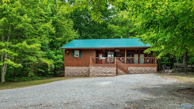 log-style house featuring a porch