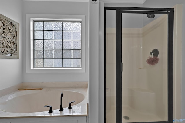 17092 Obsidian Cir, Athens, AL 35613 - bathroom featuring a stall shower, plenty of natural light, and a garden tub